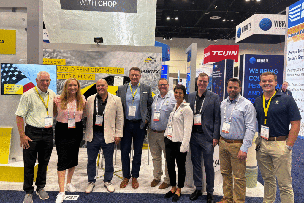 People standing together in front of an exhibition stand