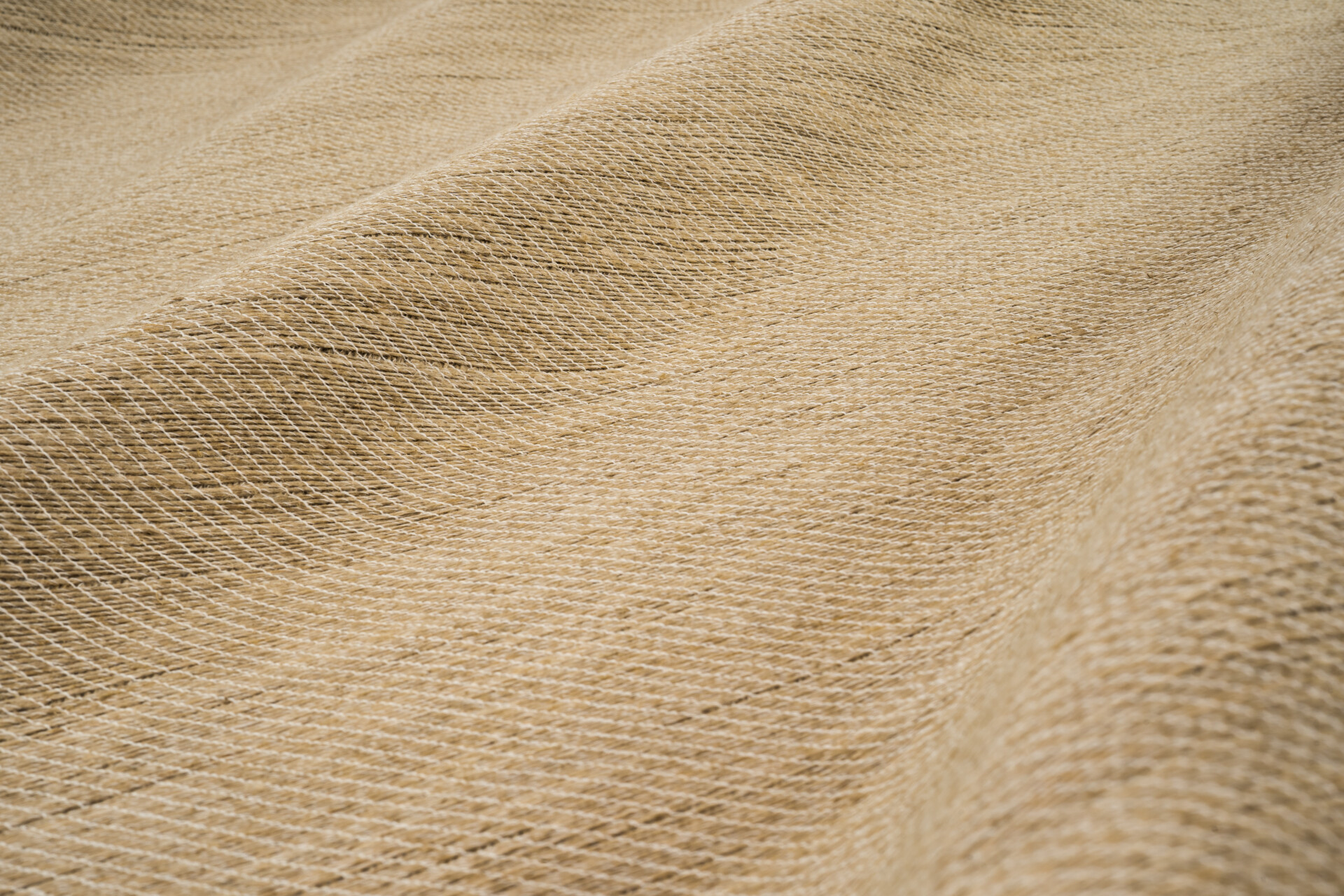 Close-up of beige woven fabric