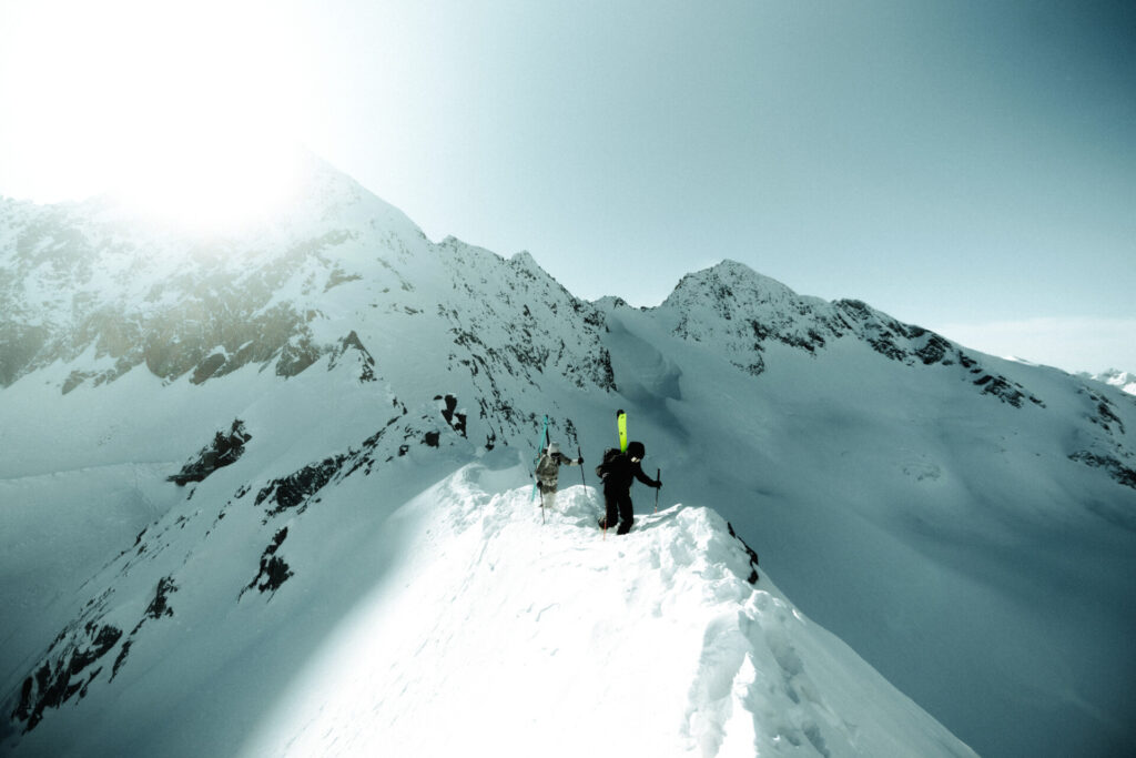 Three mountaineers on a snow-covered peak