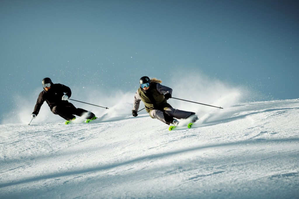 Two skiers on a snow-covered slope