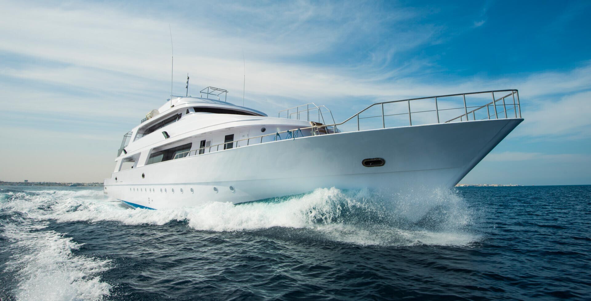 A luxury boat cruises across the water