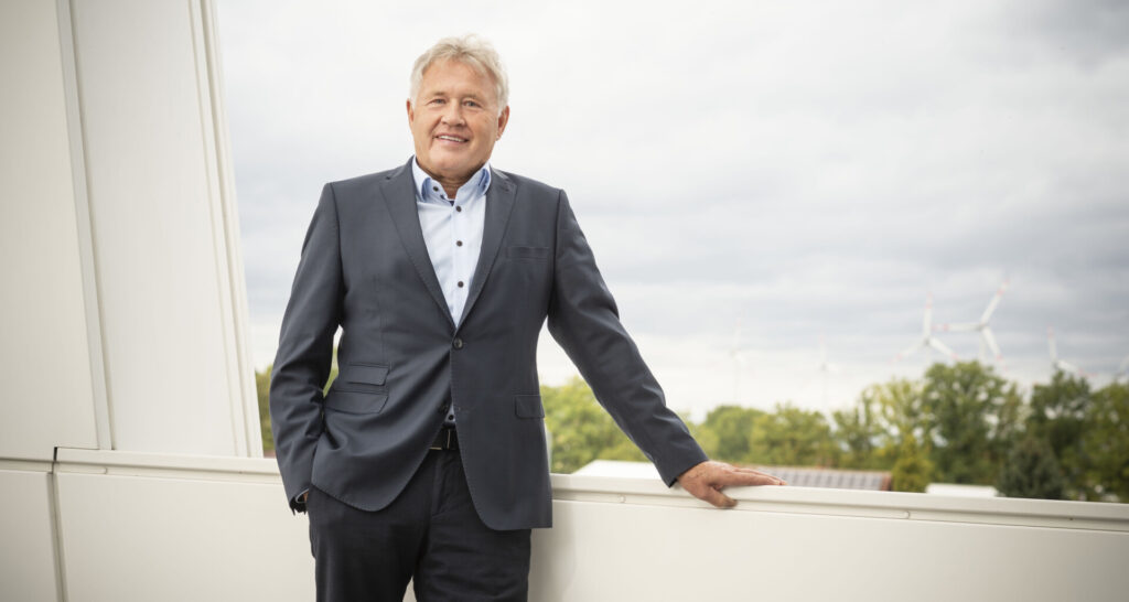 Person in a suit standing outdoors